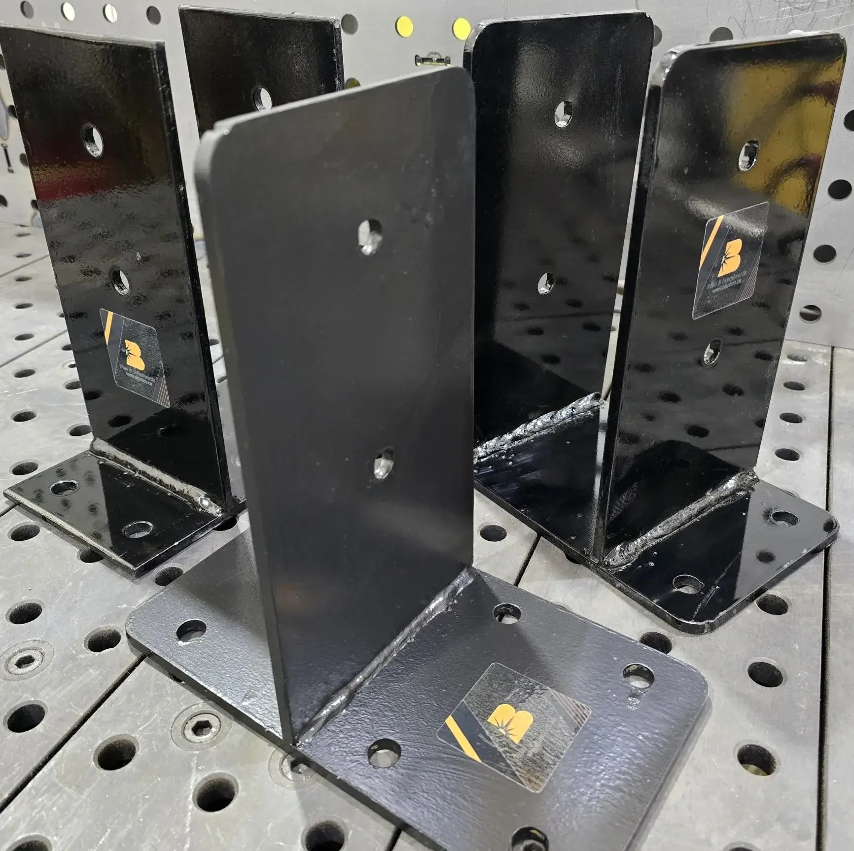 Black steel L-brackets with mounting holes